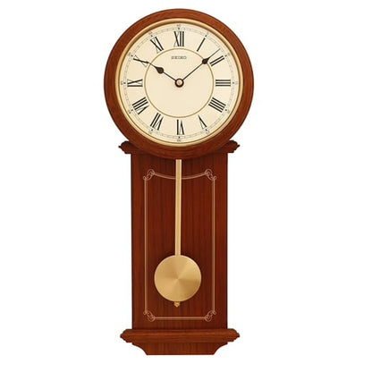 Wooden wall clock with pendulum on a white background