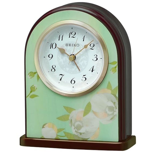 Seiko clock with floral design on a light green background