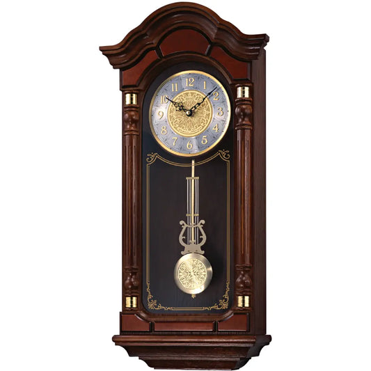 Wooden wall clock with pendulum on a white background