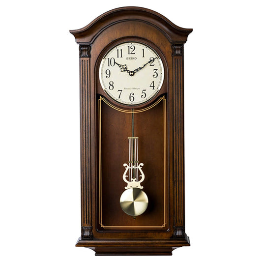Wooden wall clock with pendulum on a white background