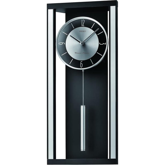 Seiko wall clock with pendulum on a white background
