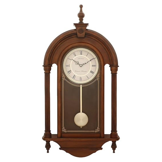 Wooden wall clock with pendulum on a white background