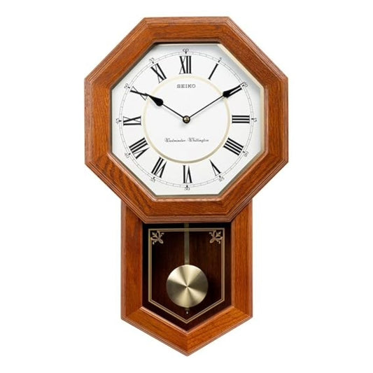 Wooden Seiko wall clock with pendulum on a white background