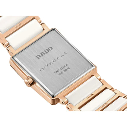 Rado watch with rose gold case and white band on a white background