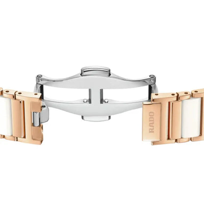 Two watch bracelets, one silver and one rose gold, on a white background.