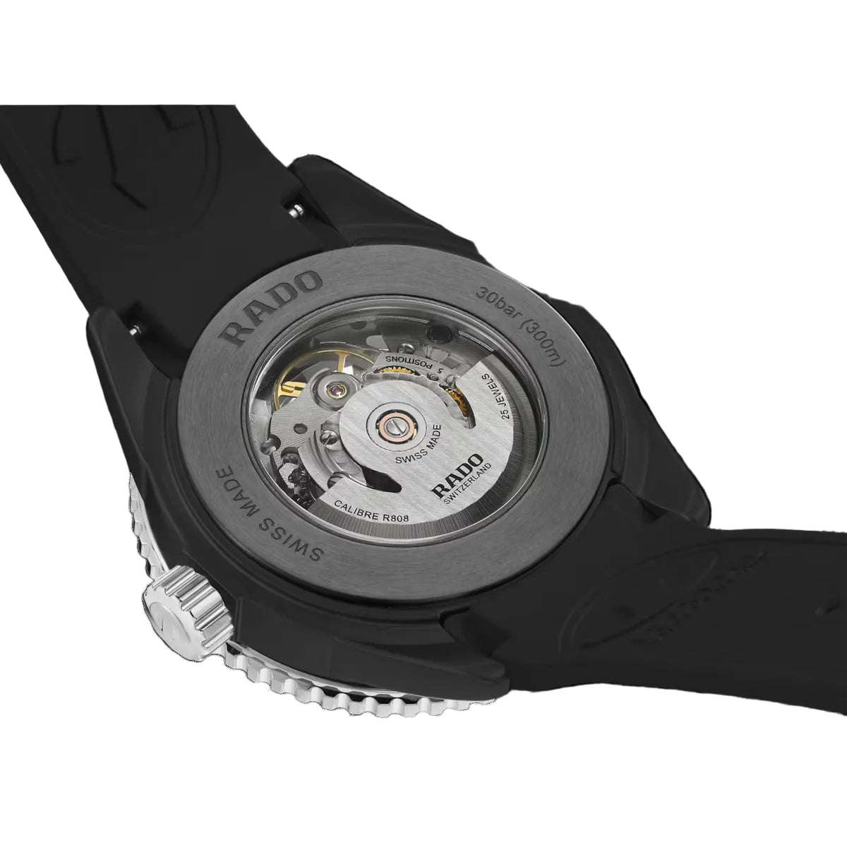 Close-up of a Rado watch with visible mechanical components on a black background