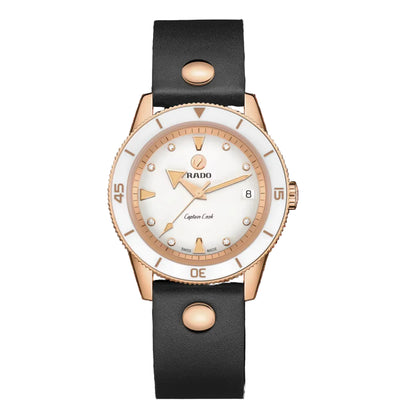 Rado watch with rose gold case and black leather strap on a white background