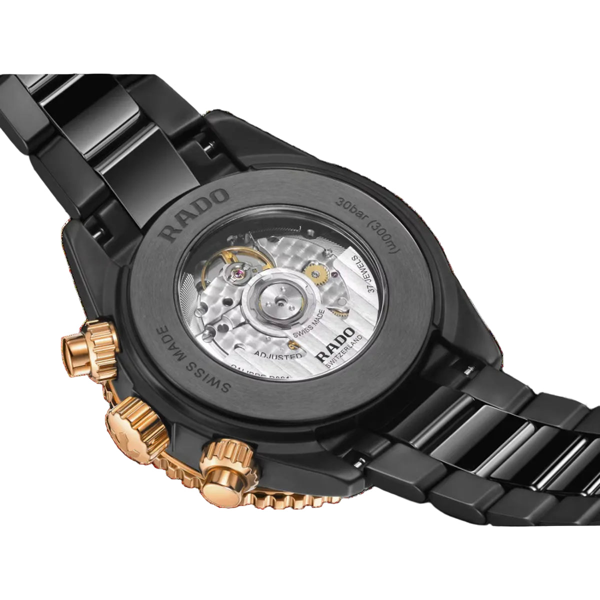 Close-up of a Rado watch with black and gold design on a clear background