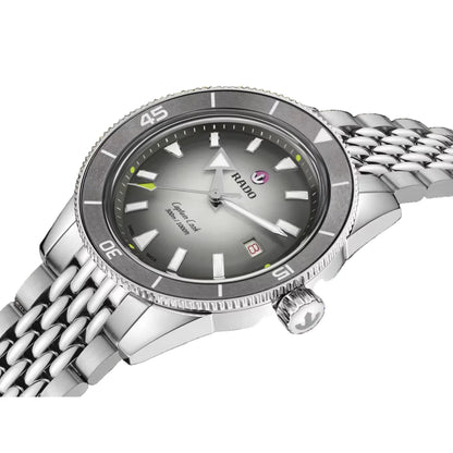 Silver watch with a dark gray face on a black background