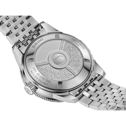 Silver watch with detailed face and brand name on a black background