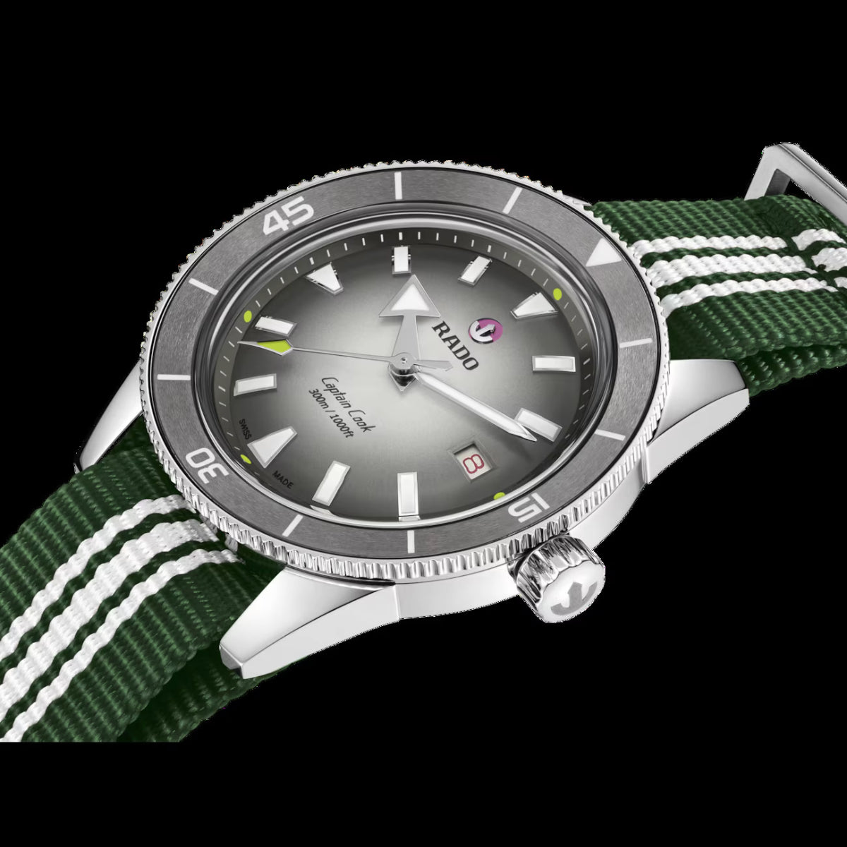 Watch with green strap and silver case on a black background