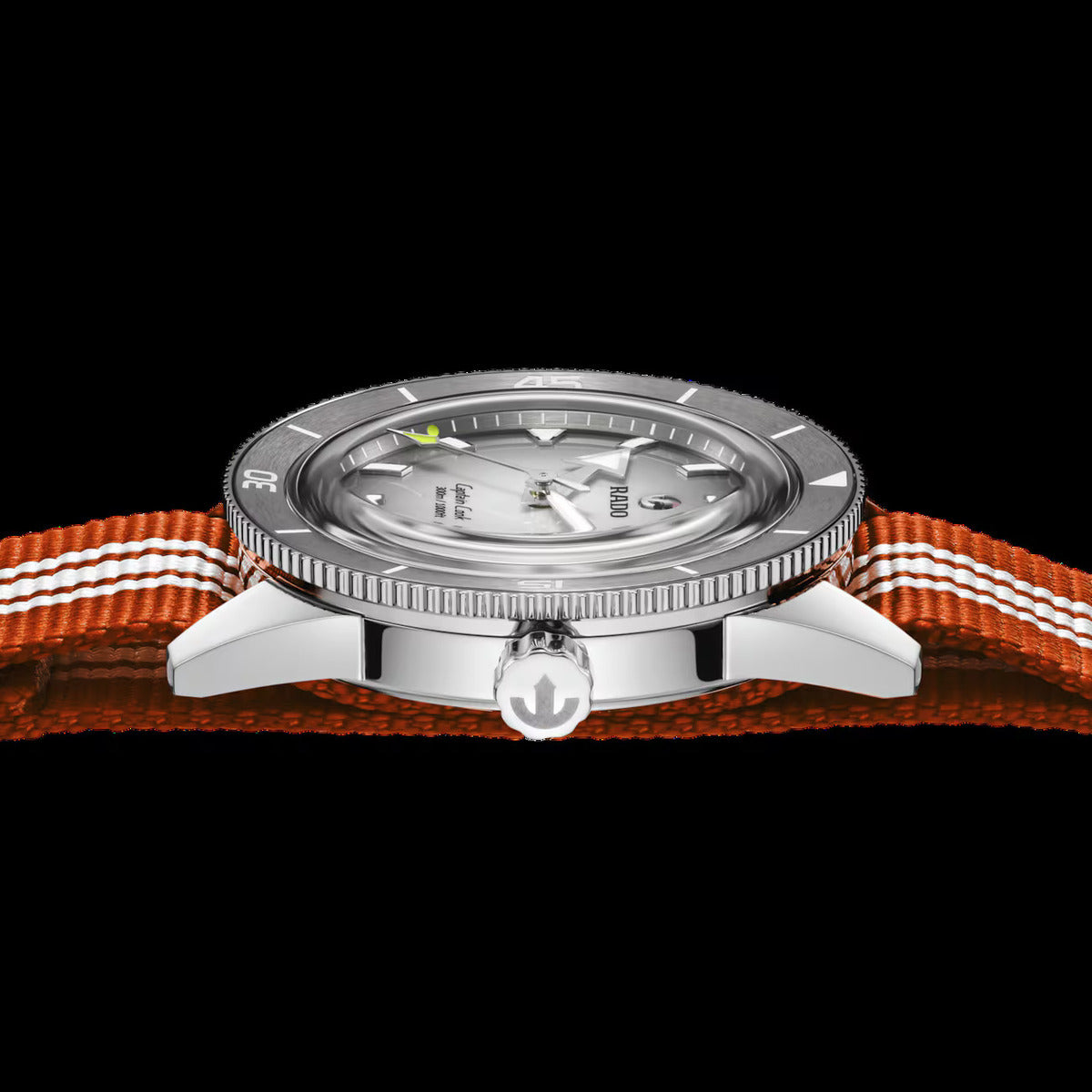 Watch with orange strap and silver case on a black background