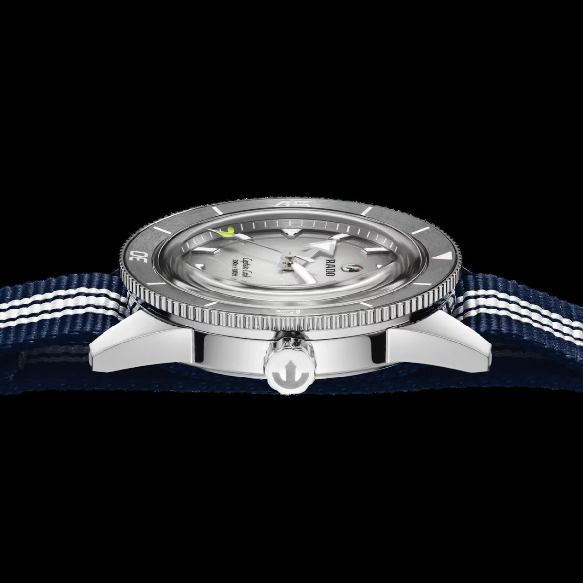 Watch with a blue strap and silver case on a black background