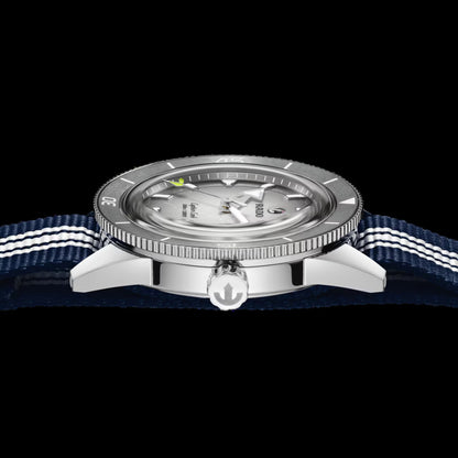 Watch with a blue strap and silver case on a black background