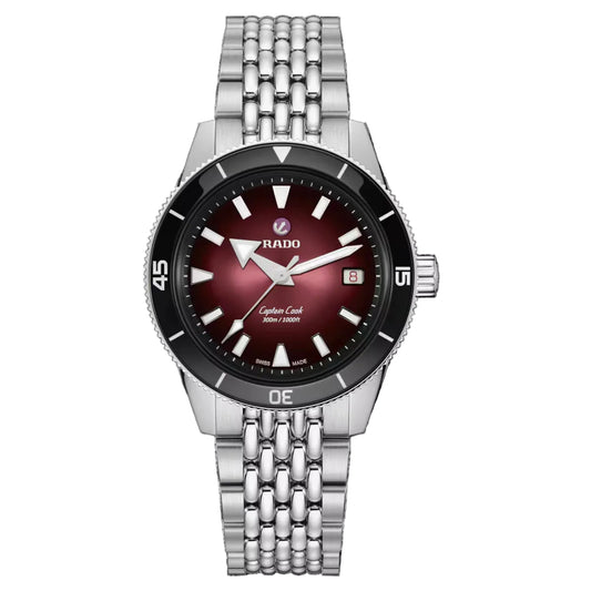 Silver watch with a red face on a black background