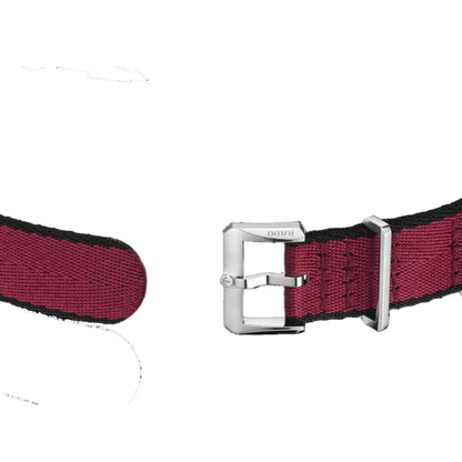 Red woven belt with silver buckle on a black background