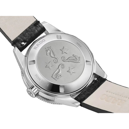 Close-up of a watch with a black strap and silver case on a white background