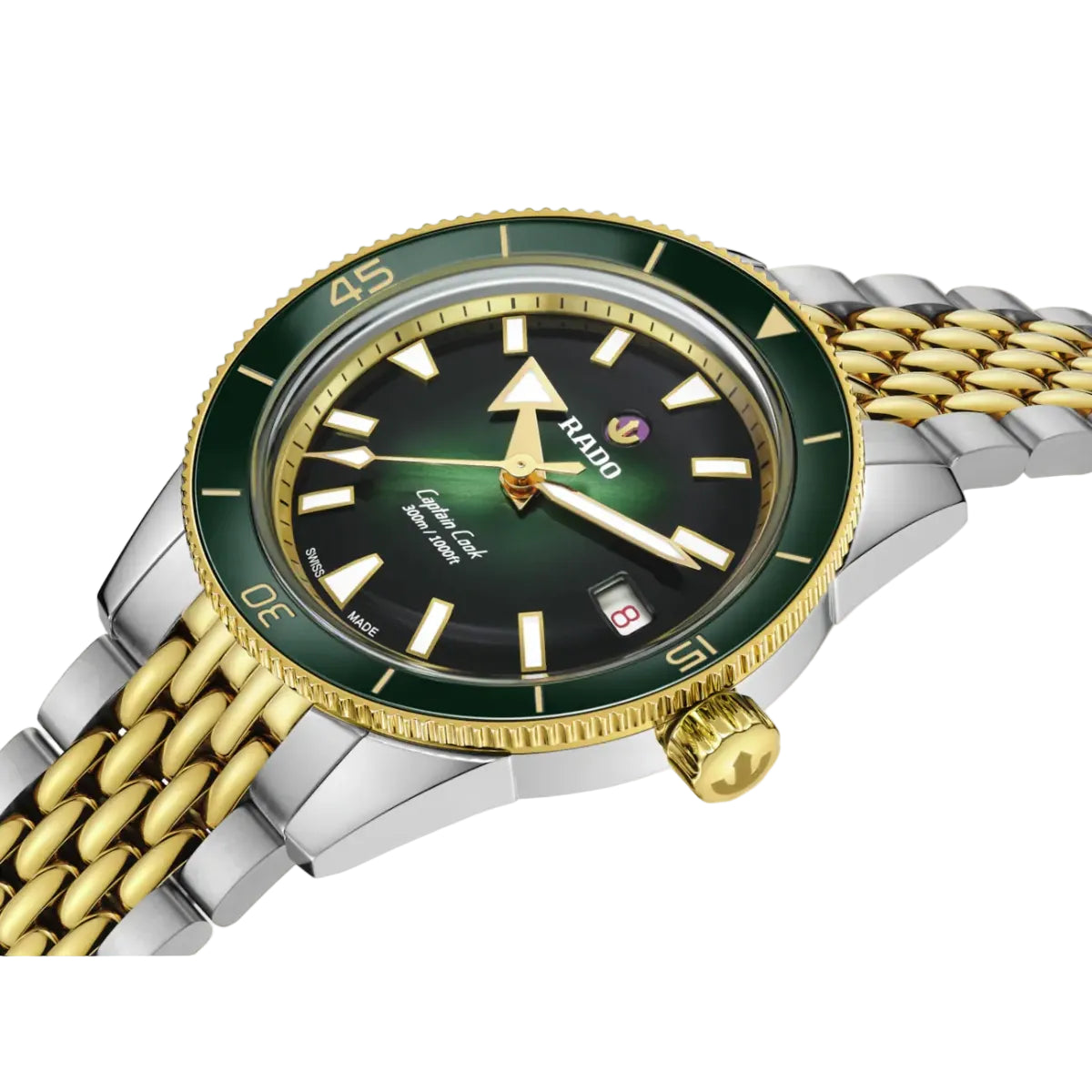 Watch with green face and gold and silver band on white background