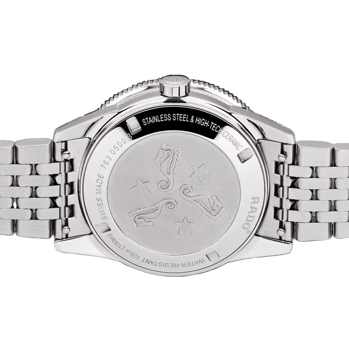 Silver watch with engraved design on a black background