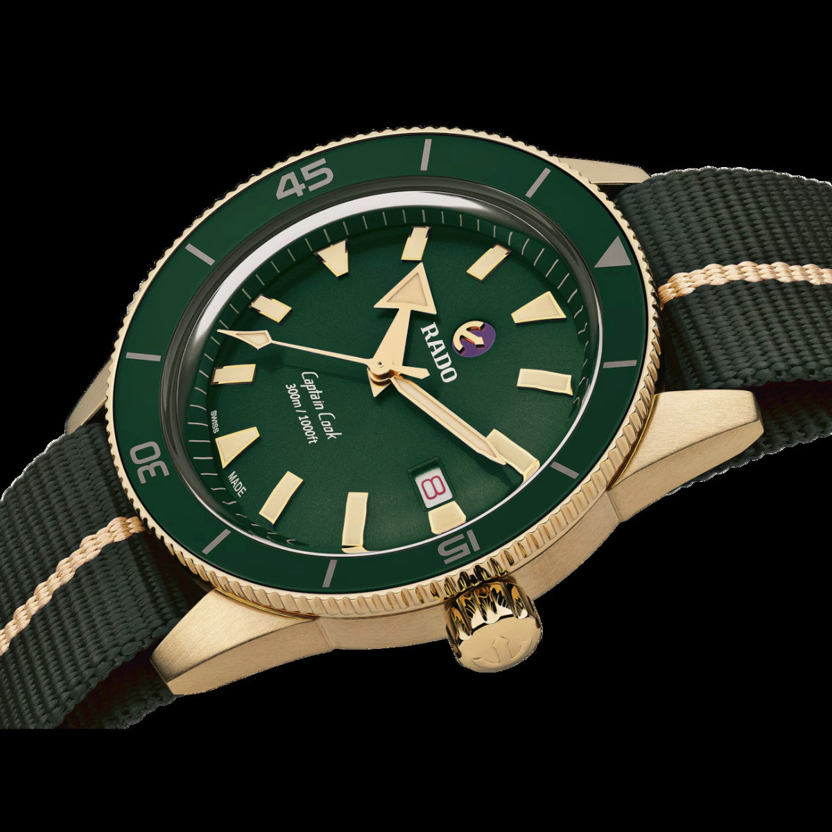 Green watch with gold accents on a black background