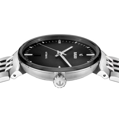 Silver watch with black dial on a white background