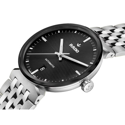 Rado watch with black dial and silver metal strap on a white background