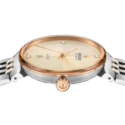 Watch with rose gold and silver design on a black background