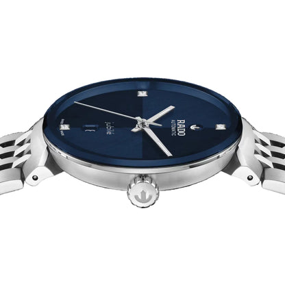 Wristwatch with blue dial and silver case on a black background