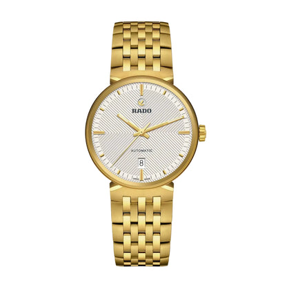 Gold Rado watch on a white background