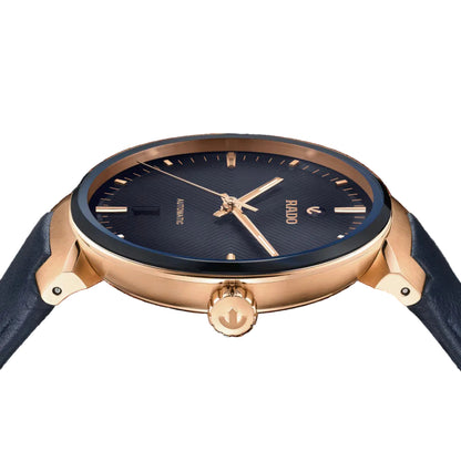 Wristwatch with blue face and rose gold case on a black background