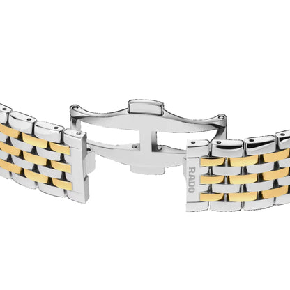Two-tone silver and gold bracelet on a black background