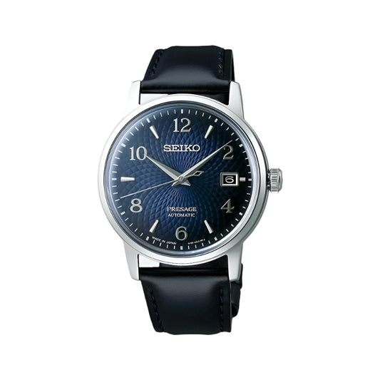 A Seiko Presage Cocktail Time men's watch with a blue dial and a black leather band.