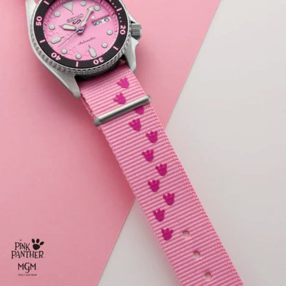 Watch with pink strap featuring heart patterns on a pink background, branded 'Pink Panther MGM'.