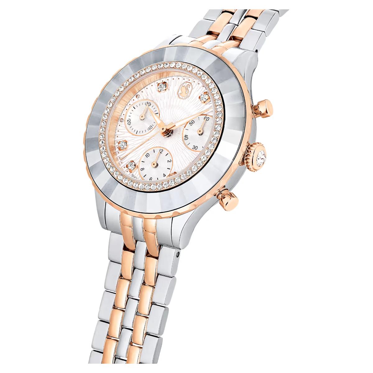 Two-tone silver and rose gold watch with a white face on a white background