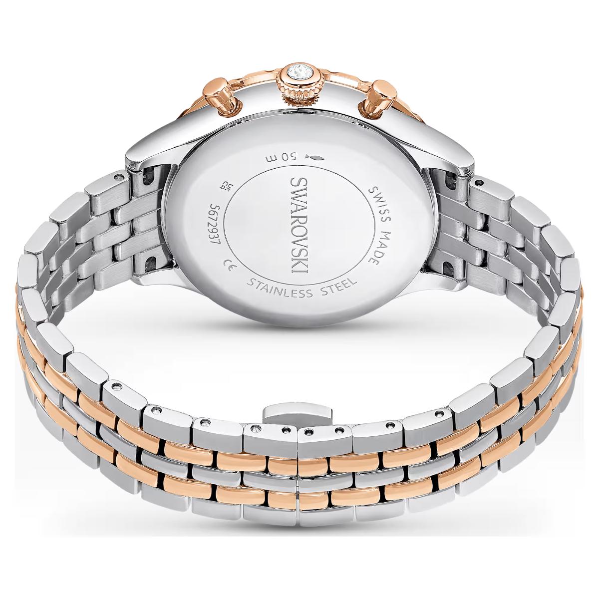 Swarovski watch with two-tone metal band on a white background