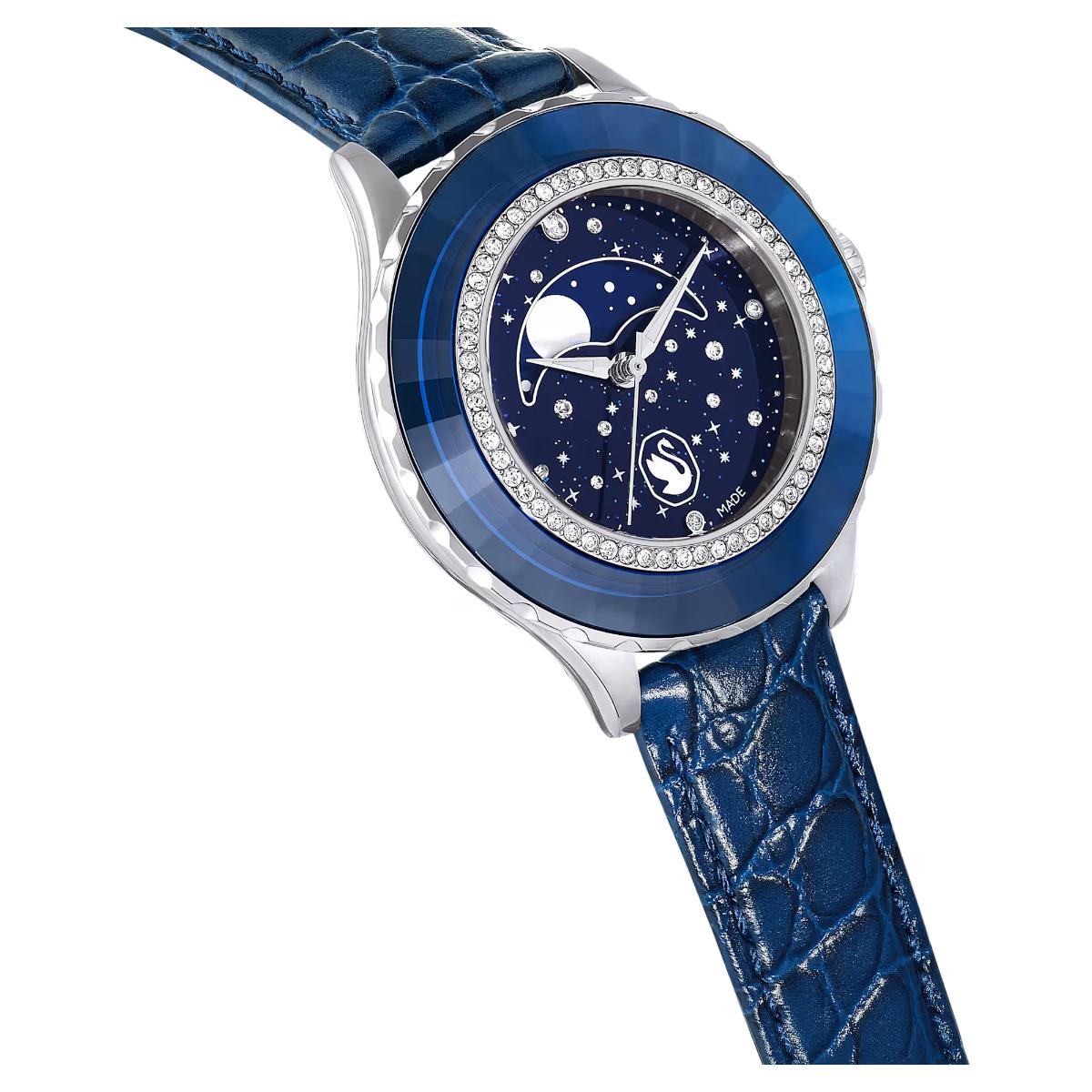 Blue wristwatch with starry night design on a white background
