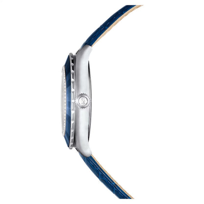 Close-up of a watch with a blue strap and silver case on a white background