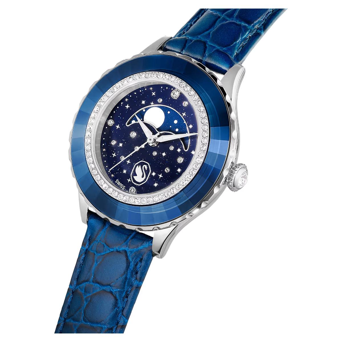Luxury watch with blue strap and starry face on a white background