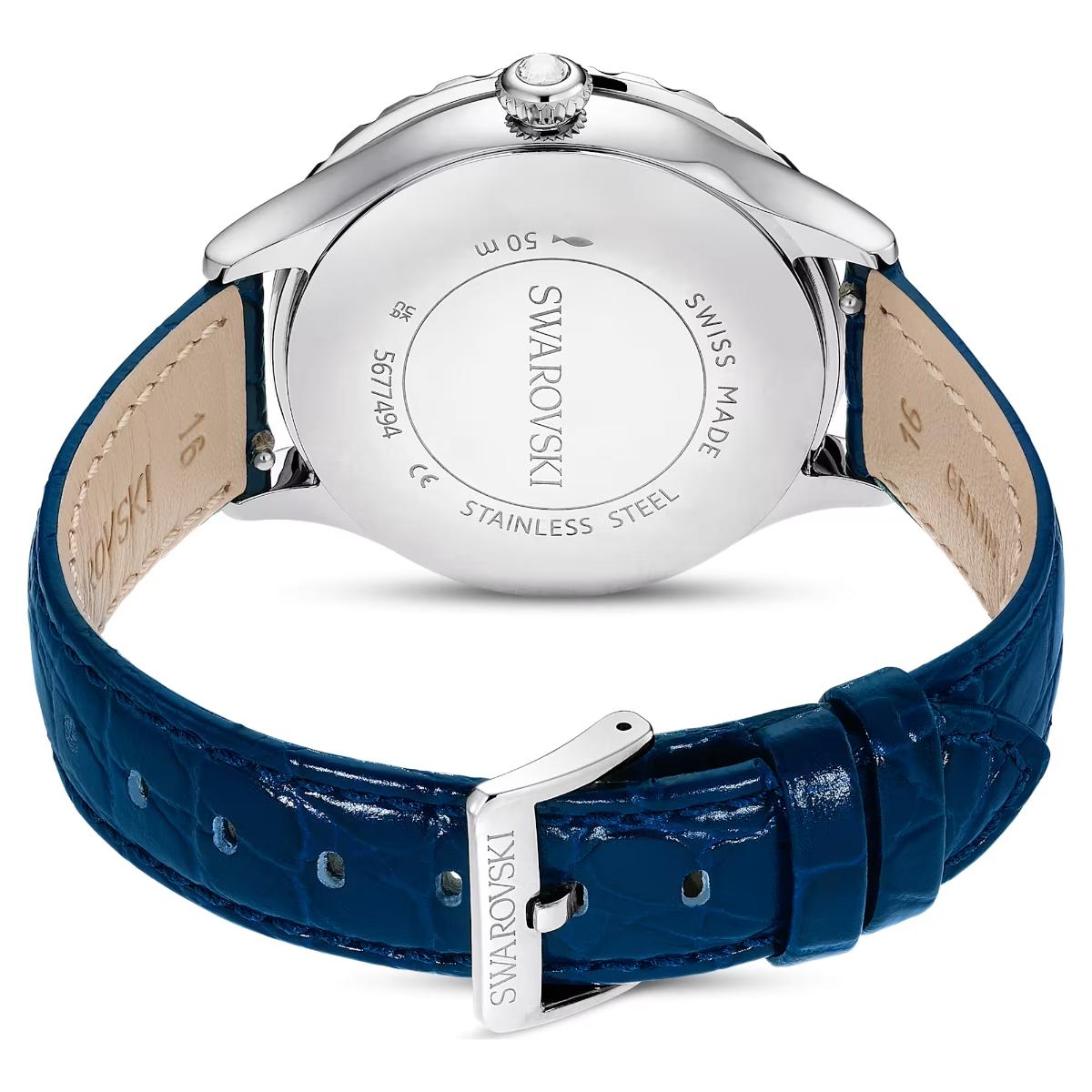 Swarovski watch with blue strap and silver case on a white background