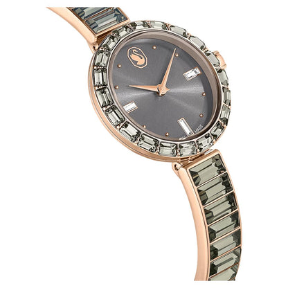Luxury watch with rose gold case and green gemstone strap on a white background