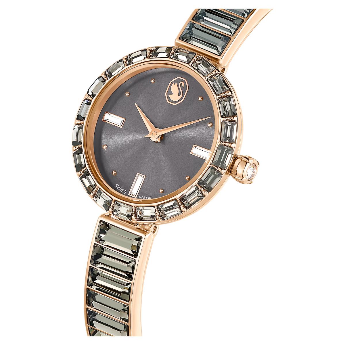 Luxury watch with rose gold case and gemstone accents on a white background