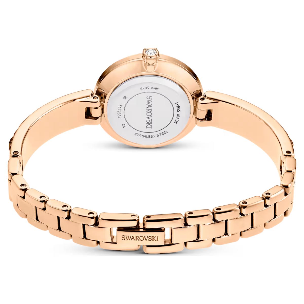 Rose gold Swarovski watch on a white background