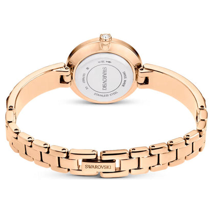 Rose gold Swarovski watch on a white background