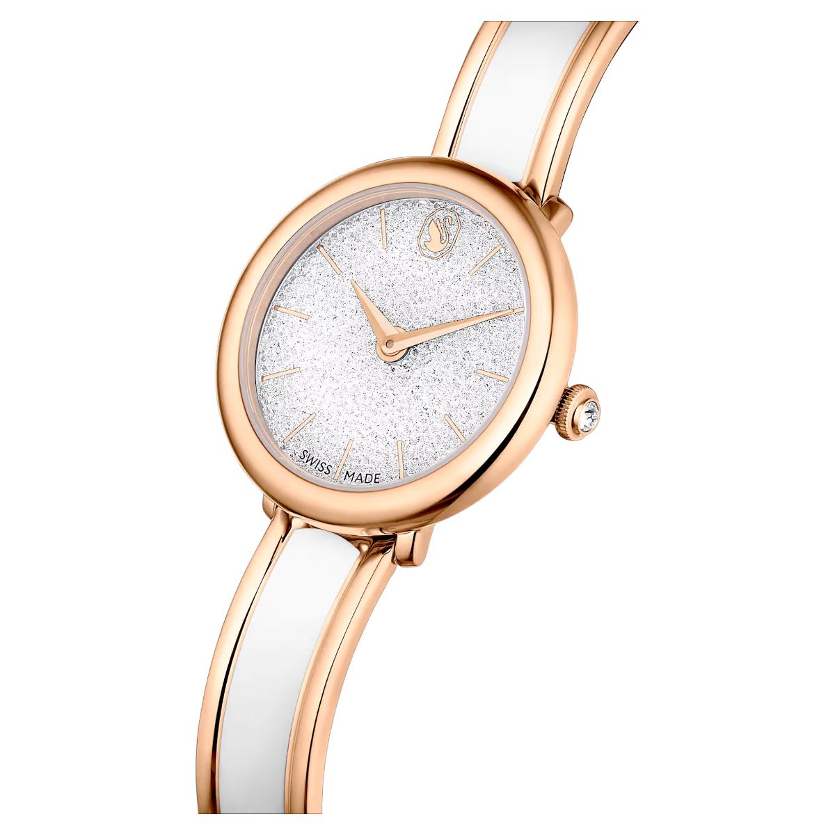 Watch with rose gold case and white strap on a white background