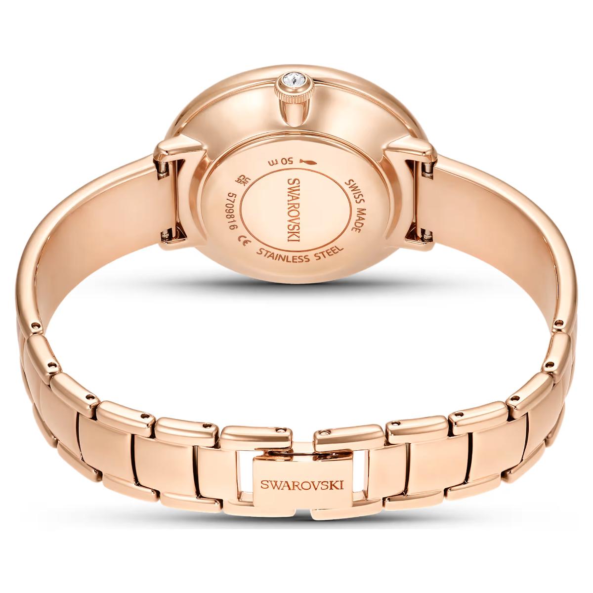Rose gold Swarovski watch on a white background