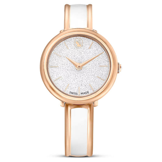 Watch with rose gold case and white band on a white background