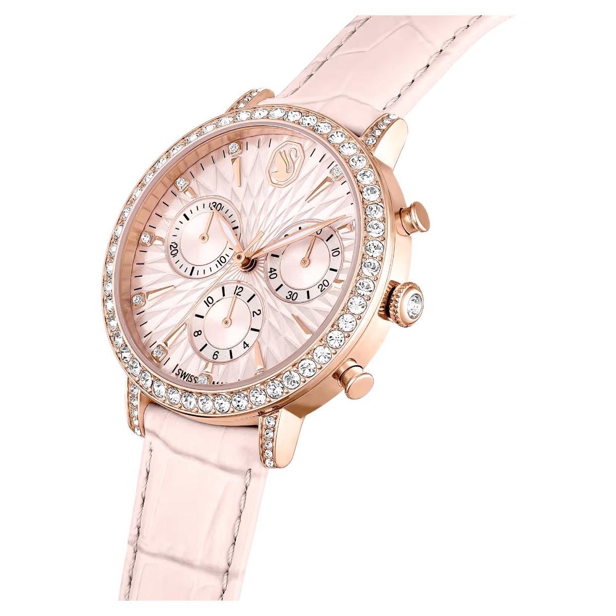 Luxury watch with pink strap and rose gold case on a white background