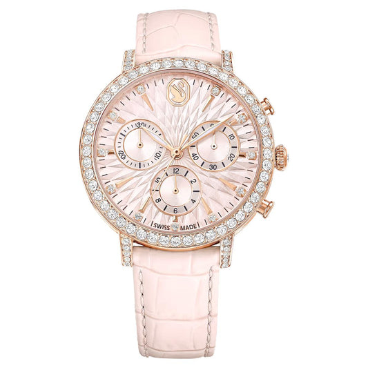 Pink watch with diamond-studded face on a white background