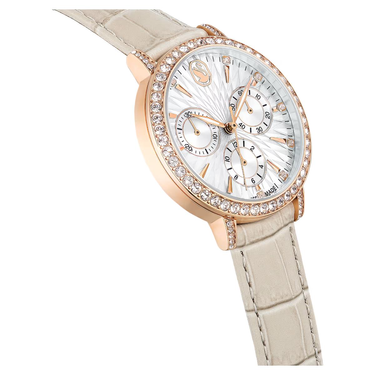 Luxury watch with rose gold case and beige strap on white background