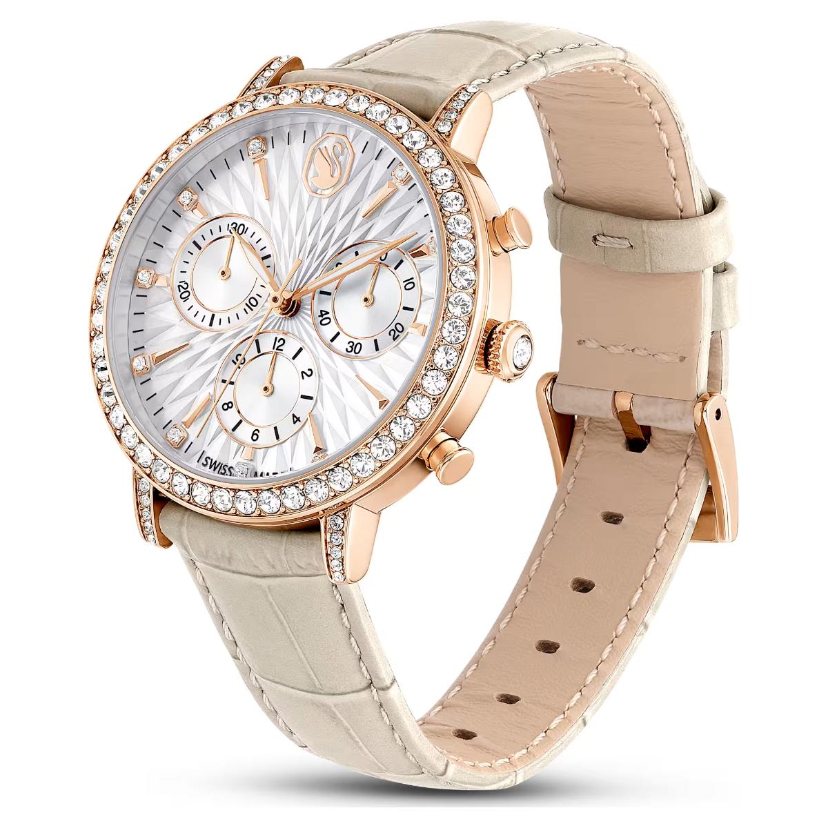 Luxury watch with rose gold case and beige leather strap on a white background